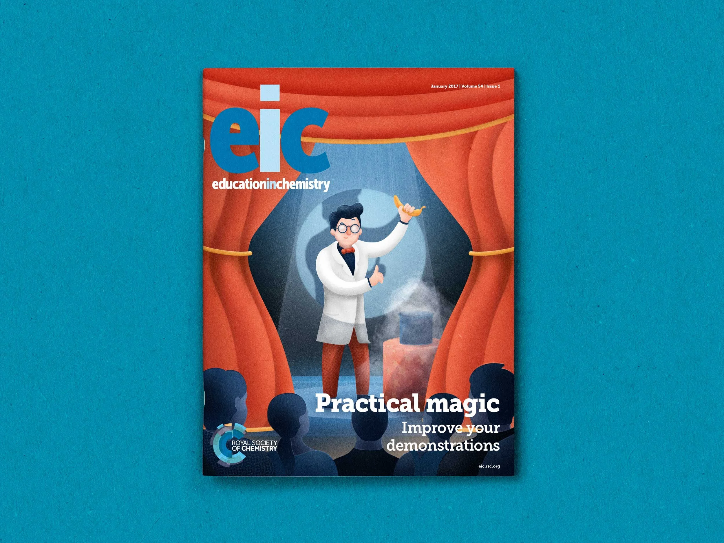 A photo of a magazine cover. The picture on the cover is a cartoon of a science teacher on stage about to perform a chemistry magic trick, there is an audience of schoolchildren watching him.
