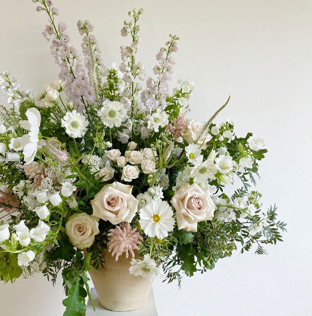 Big vases overflowing with seasonal flowers and foliages are a great way to dress your ceremony space. These can either be placed on sideboards as additional decor or on pillars at the end of the aisle.