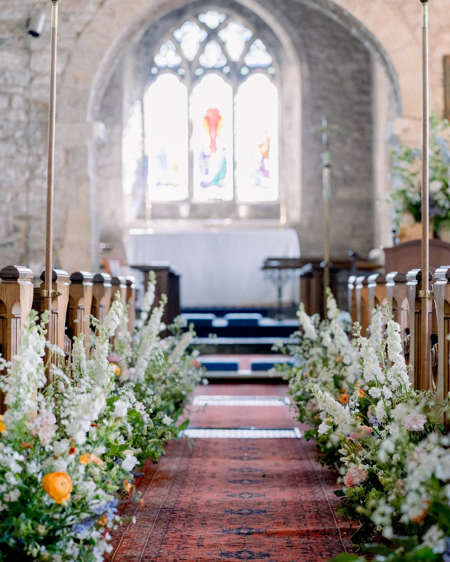Can you get anything better than an aisle full of flowers?! 

I love dressing a church aisle with beautiful meadow arrangements. They create such a wow factor for guests and a beautiful photo opportunity when you walk down the aisle to be married and