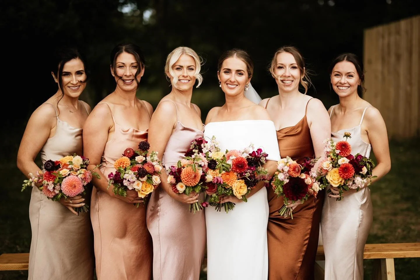 A sunset colour palette for a gorgeous outdoor wedding at @thewoodsatoakley for Ellie and Mike. 

This beautiful wedding was overflowing with gorgeous sunset coloured flowers which complimented the bridesmaids dresses beautifully. 

A perfect example
