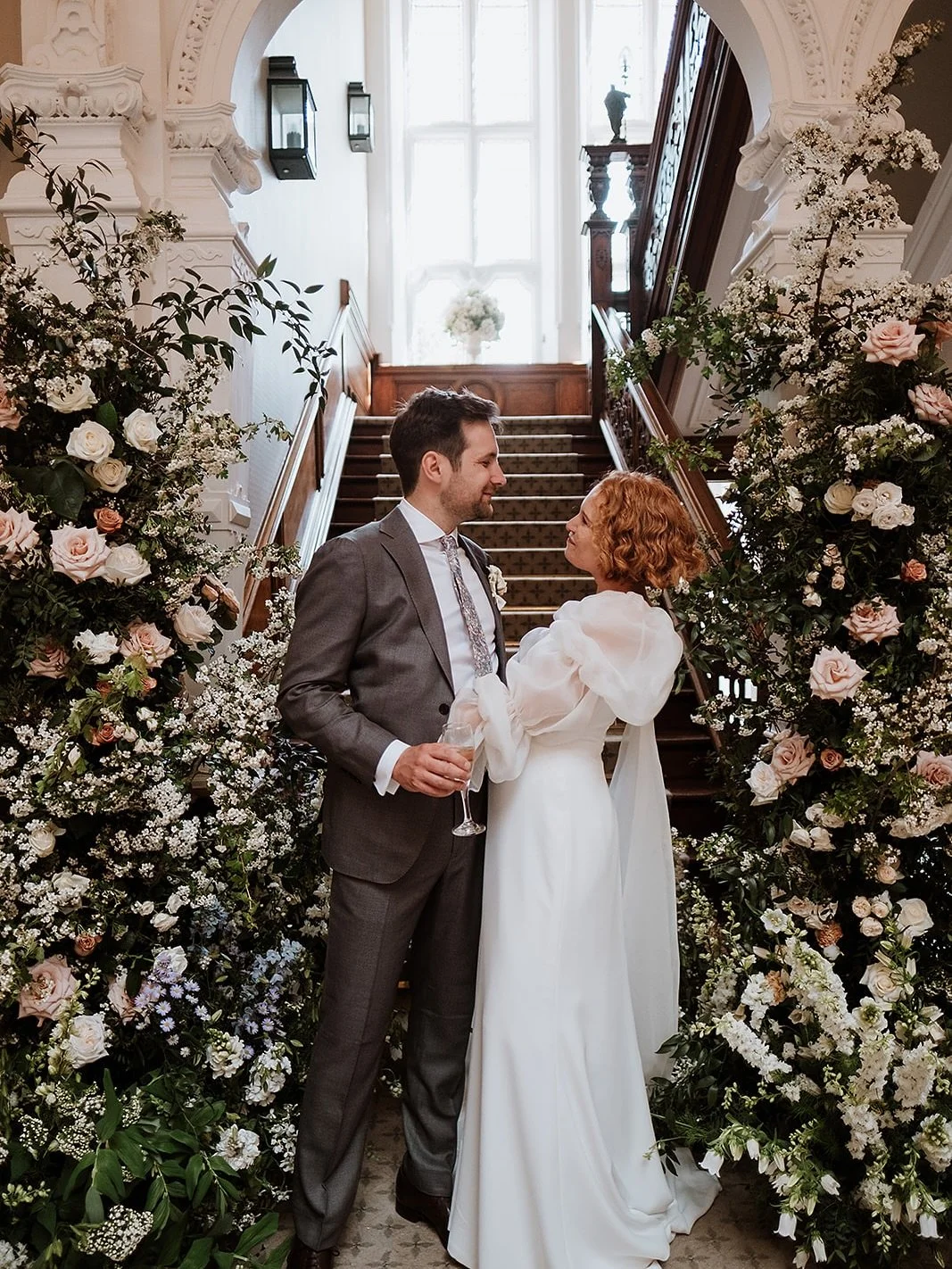 This is your sign to choose a statement backdrop for your wedding ceremony. 

We created this stunning ceremony backdrop overflowing with blossom at @clevedonhall for A&amp;Rs outdoor ceremony and then moved it to the bottom of the staircase creating