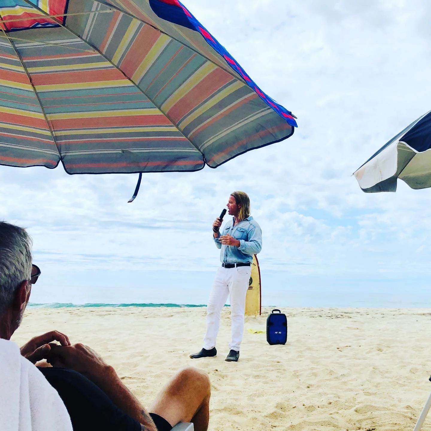 Pastor Rick-Umbrellas-Beach Church.jpg