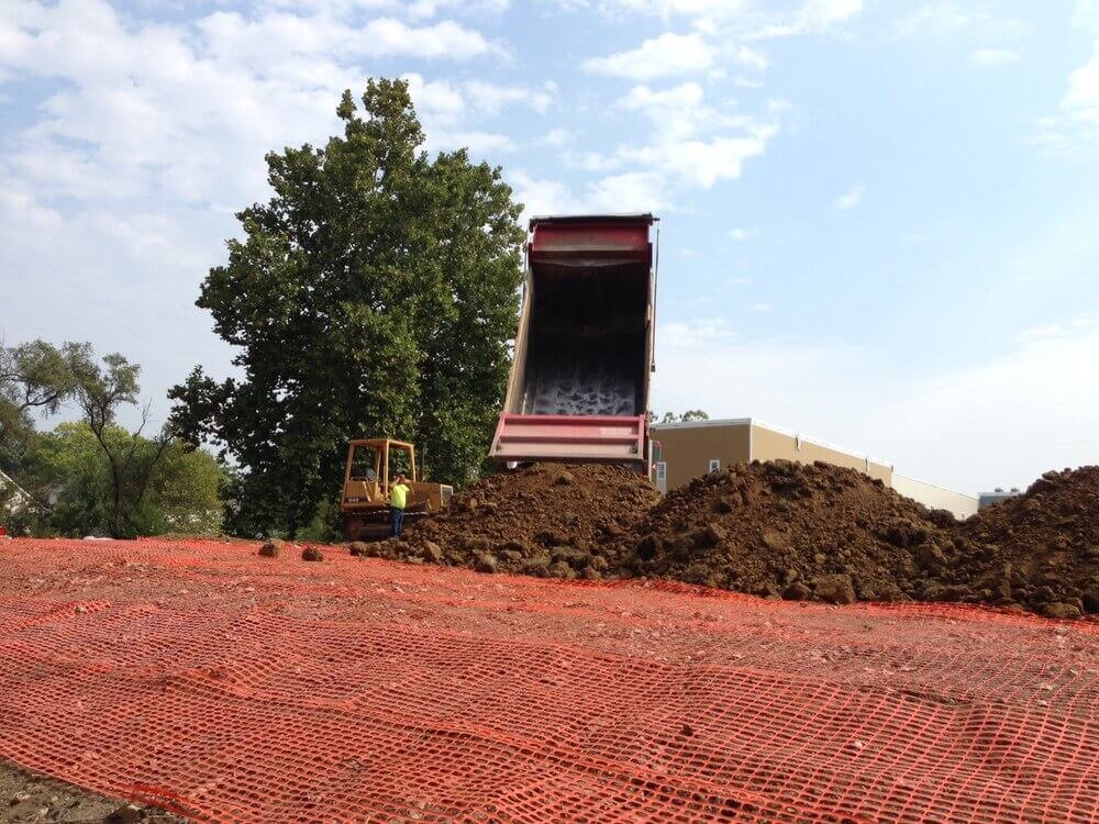 Demarcation barrier and soil cap