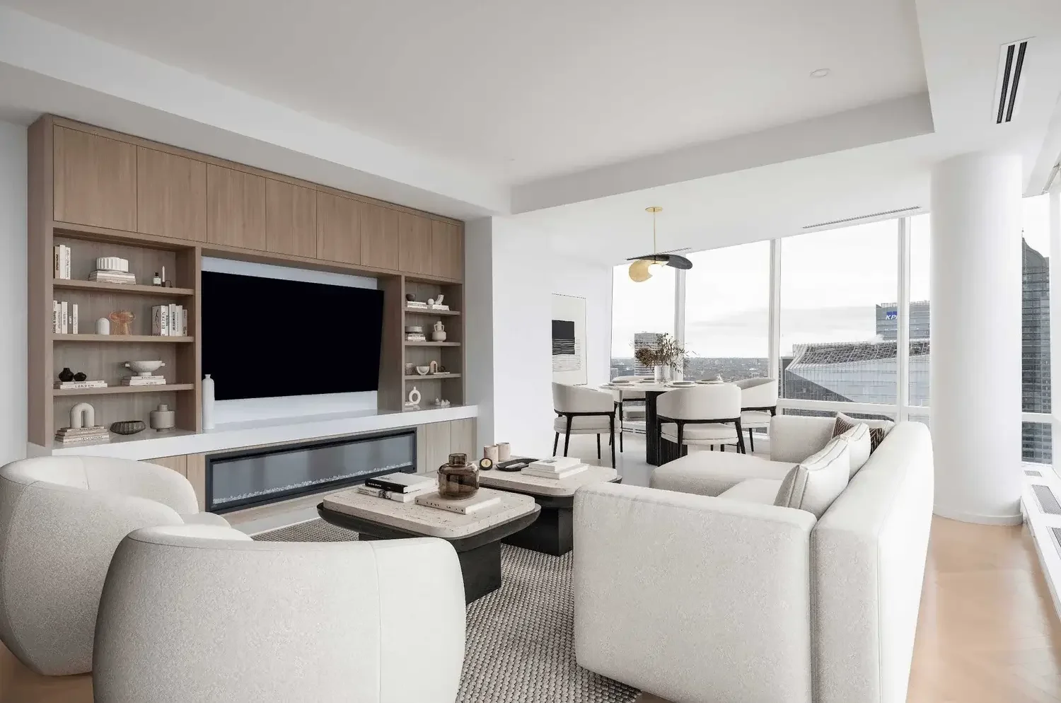 Shangri-La condo living room interior design in Toronto featuring neutral tones, built-in shelving, and luxury modern styling