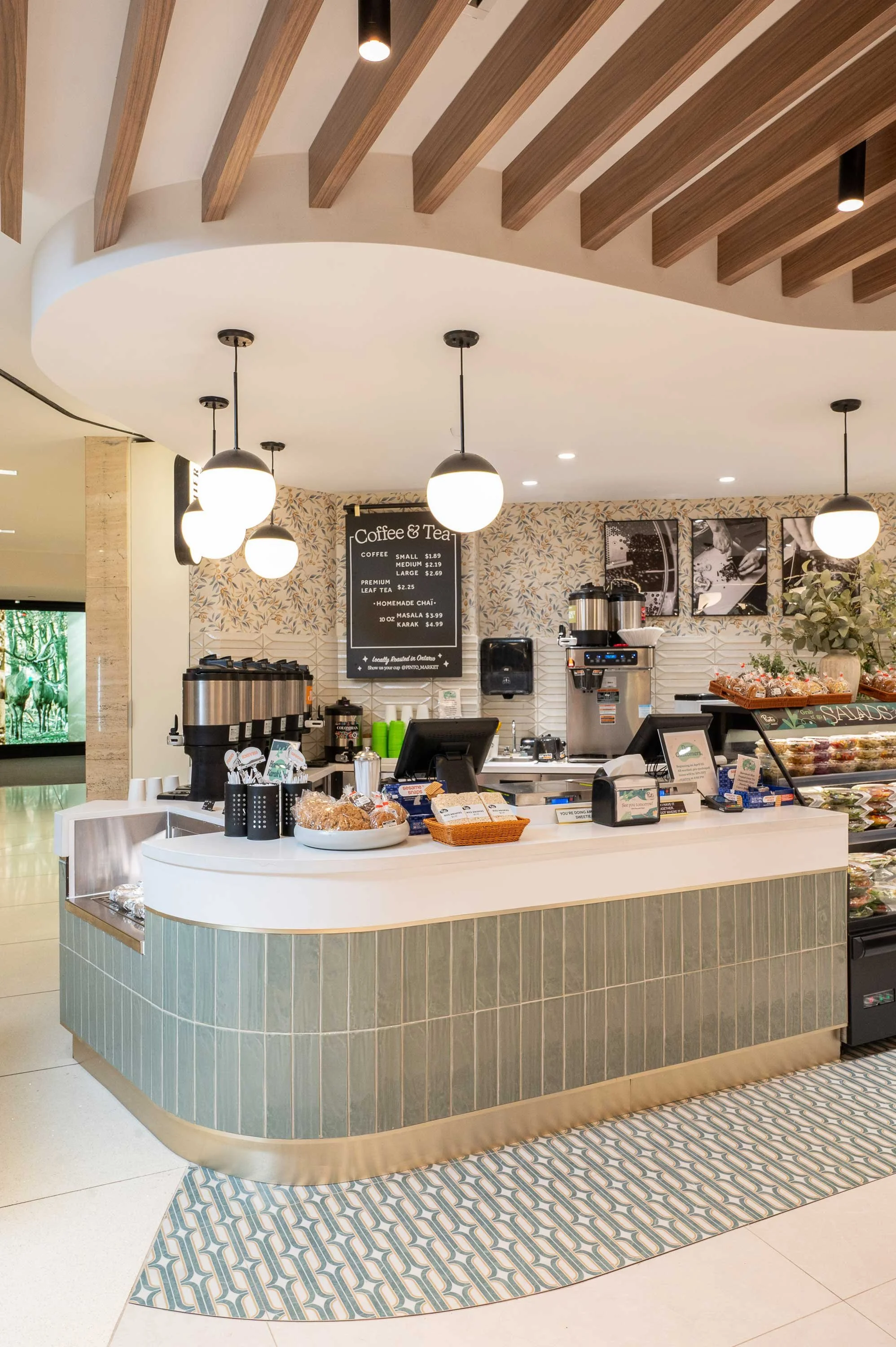 Light and earthy toned cafe counter with green, brass, and walnut accents