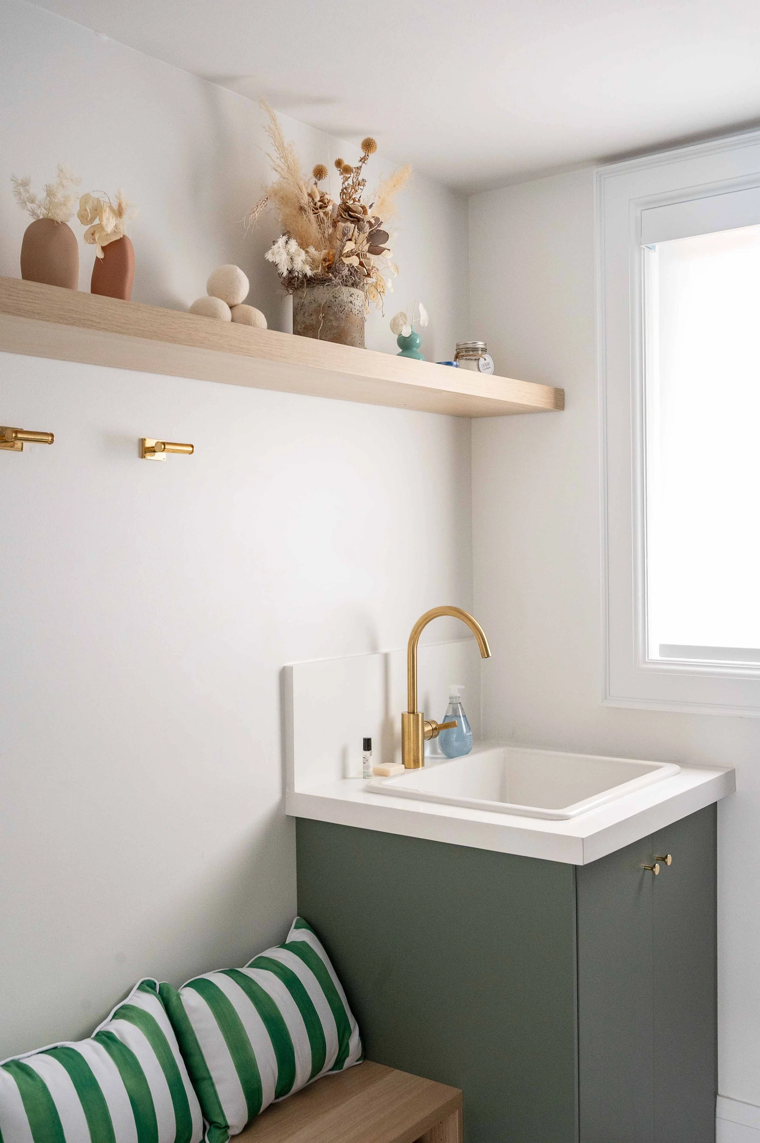 green millwork in laundry room