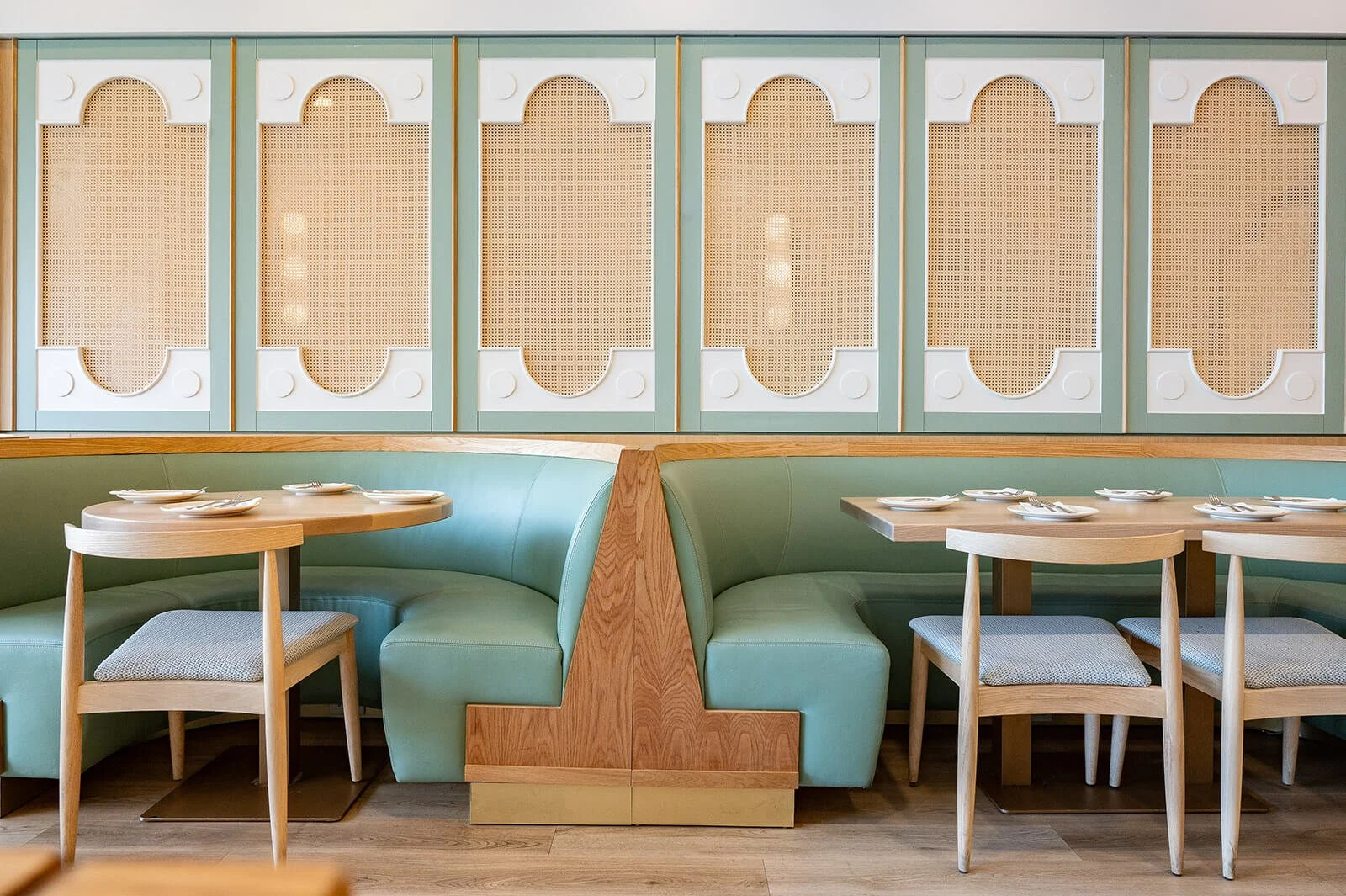 Custom banquette seating and wall panel design in a modern Middle Eastern restaurant interior in Oakville