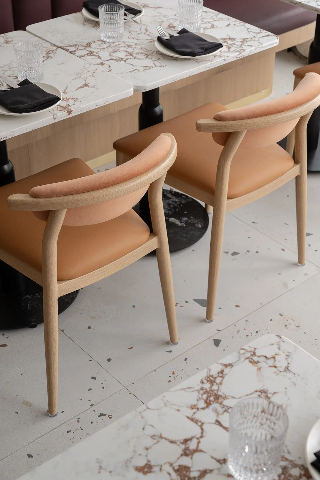 Italian restaurant dining chairs with light camel leather seat and white oak frame
