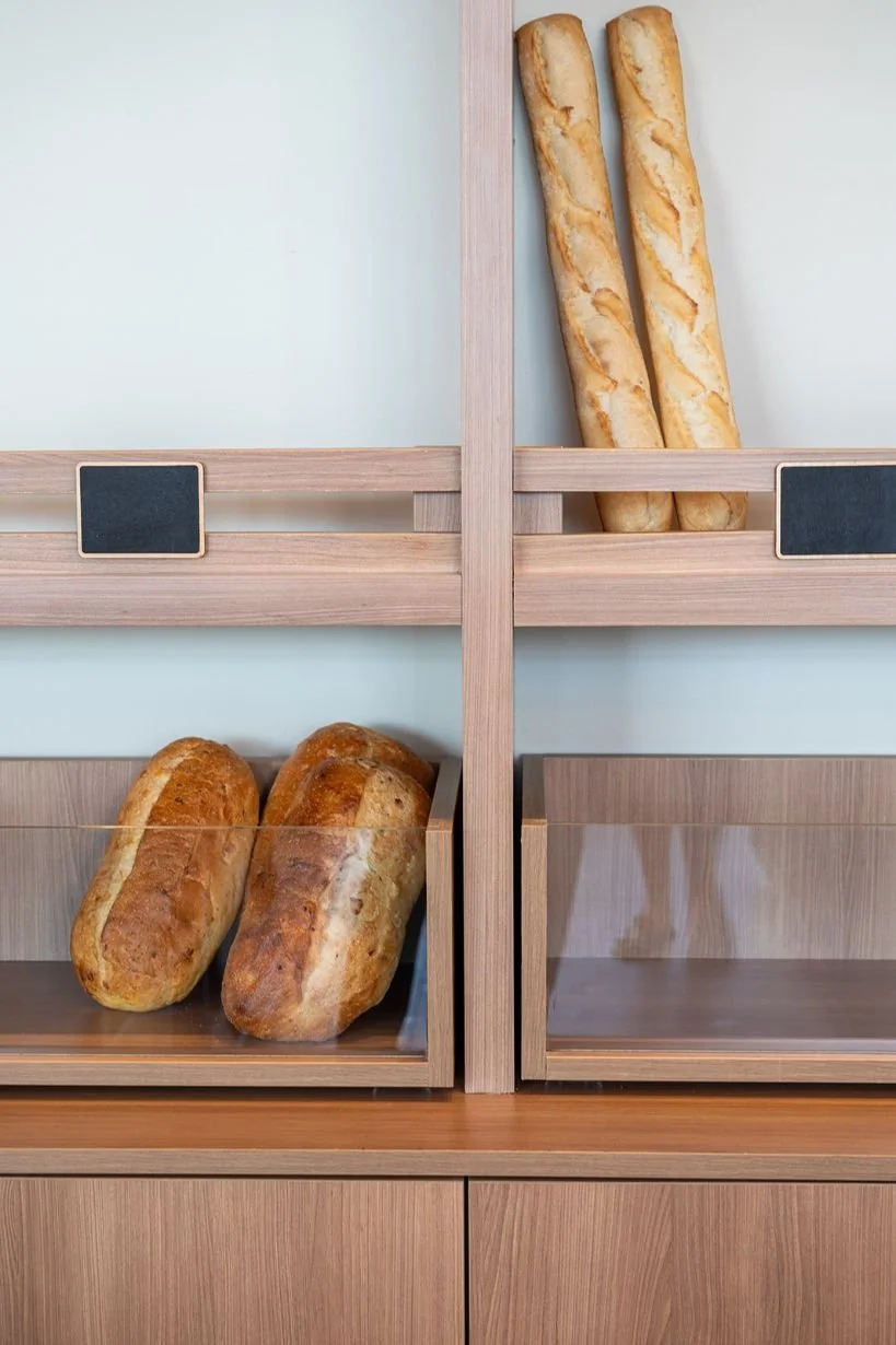 Custom wood retail display shelving with bread loafs