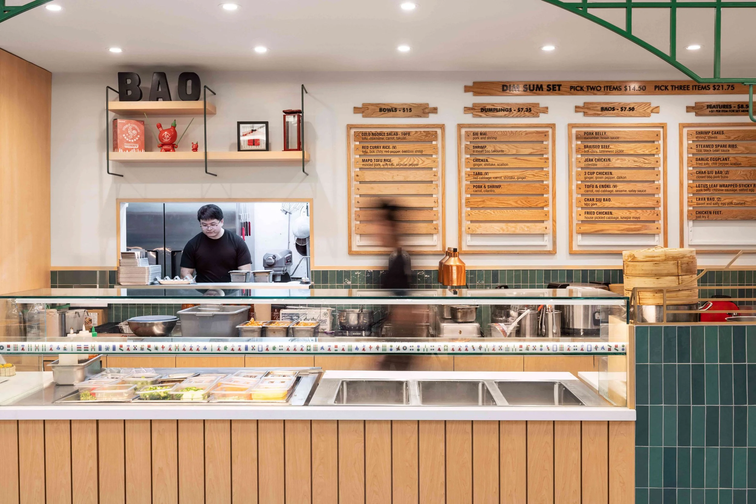 Boa quick service restaurant with green tile and warm oak wood accents