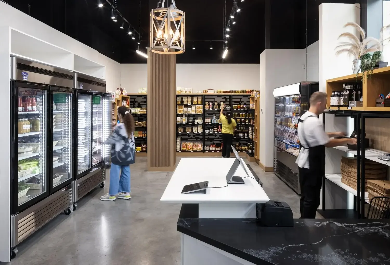 G Mercato café interior design in Toronto showcasing retail grocery layout, open shelving, and modern commercial lighting