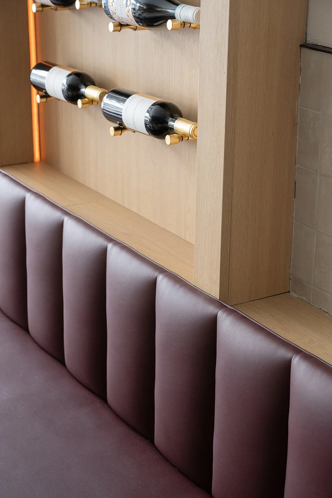 Banquette burgundy red channeled back rest