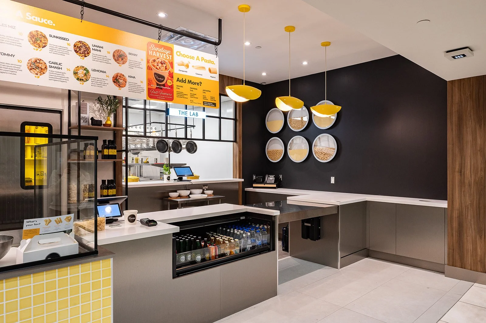 Stainless steel industrial style counter face with pasta menu suspended above
