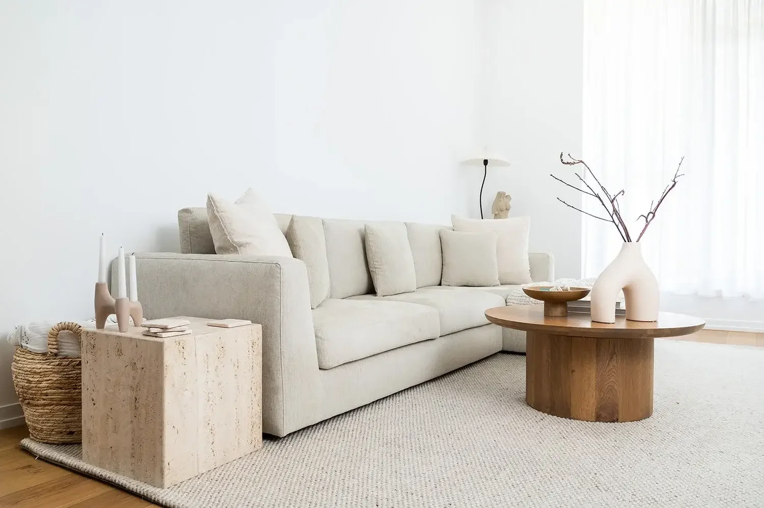 Contemporary living room interior design in Toronto featuring neutral tones, natural light, and minimalist furniture styling