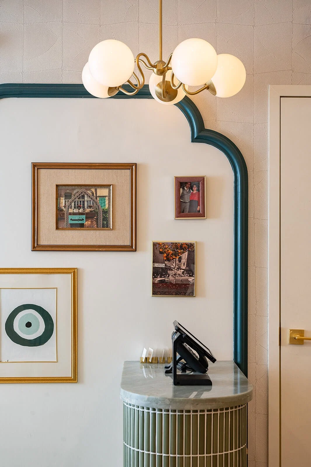 Modern Mediterranean restaurant interior detail featuring arched forms, artwork, and warm neutral tones inspired by Lebanese culture by Sansa Interiors- custom art, Tabule Oakville