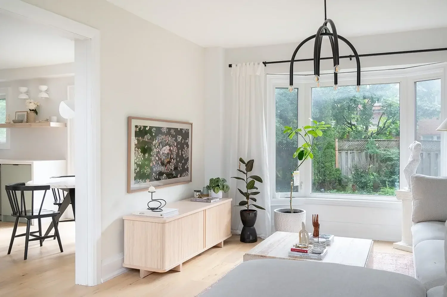 Full house renovation in Burlington showcasing modern living room design with light wood finishes and contemporary décor