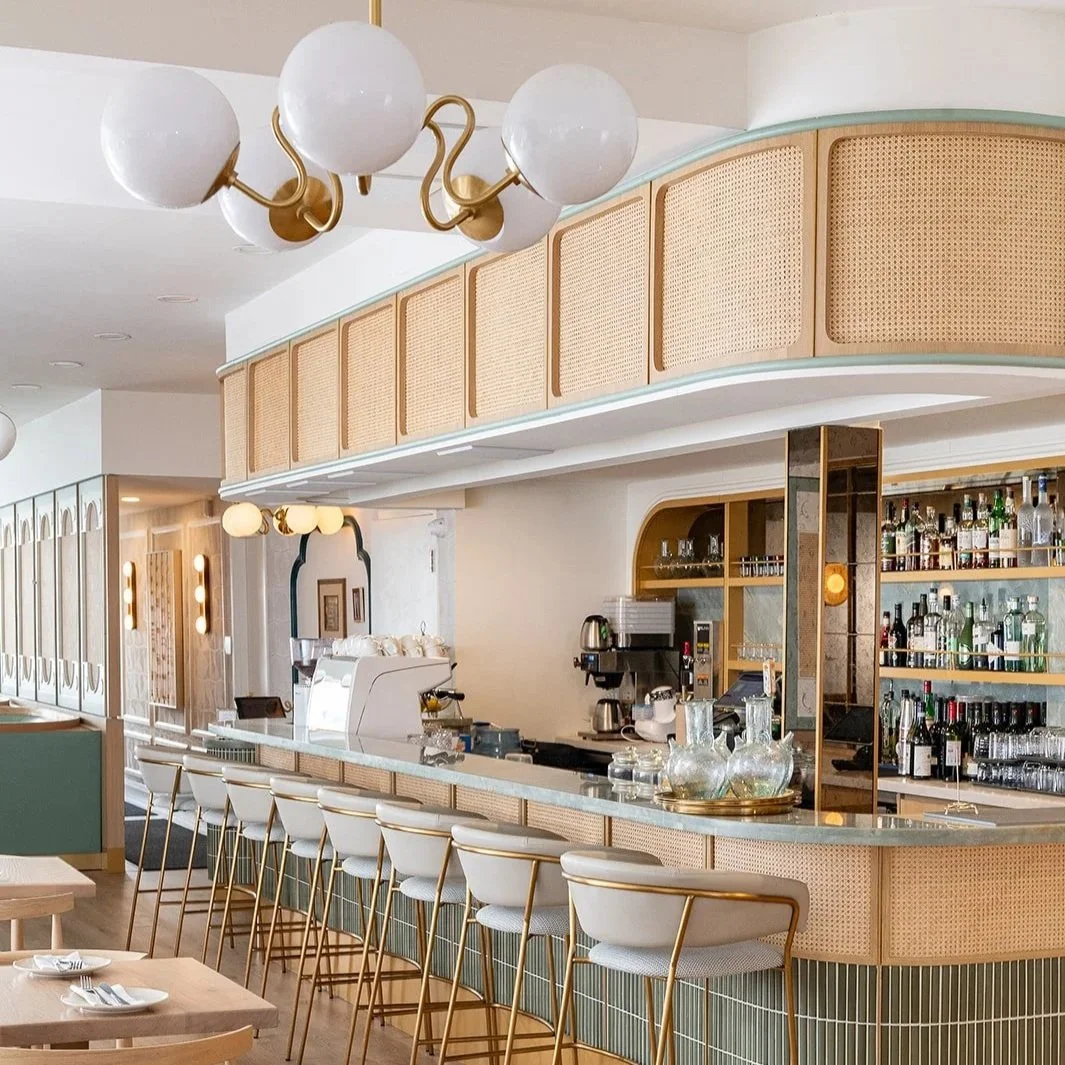 Modern Mediterranean restaurant custom bar design with cane webbing and brass fixtures, in Oakville, part of the Greater Toronto Area by Sansa Interiors