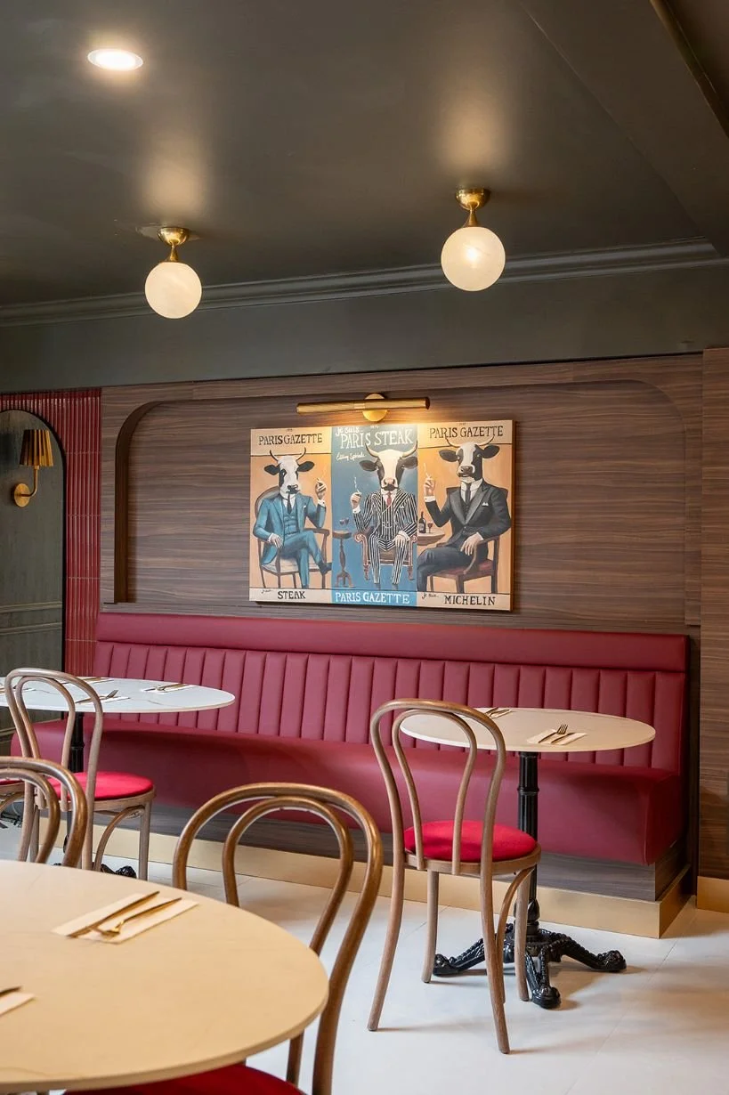 restaurant burgundy banquette and walnut wood wall