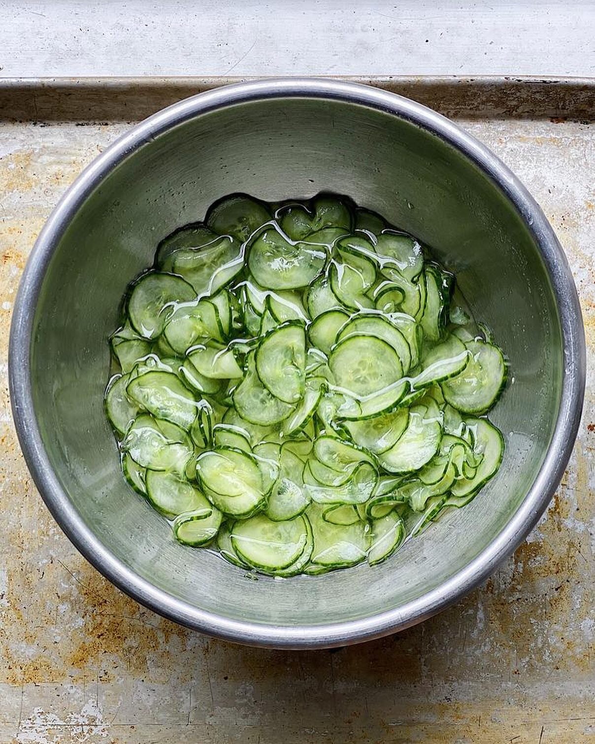 Too hot to cook? Here is the ingredients list for Candy&rsquo;s Cukes over steamed rice and a conversation with @baburoset in @foodandwine magazine about our beloved @zojirushi_official rice cooker 🍚 
Link to Recipe in Bio
🥒🥒🥒
Ingredients:
&frac1