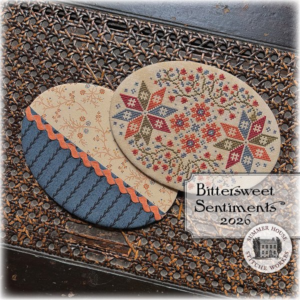 Oval cross stitched floss board with reverse side pocket made from complimentary cottons.