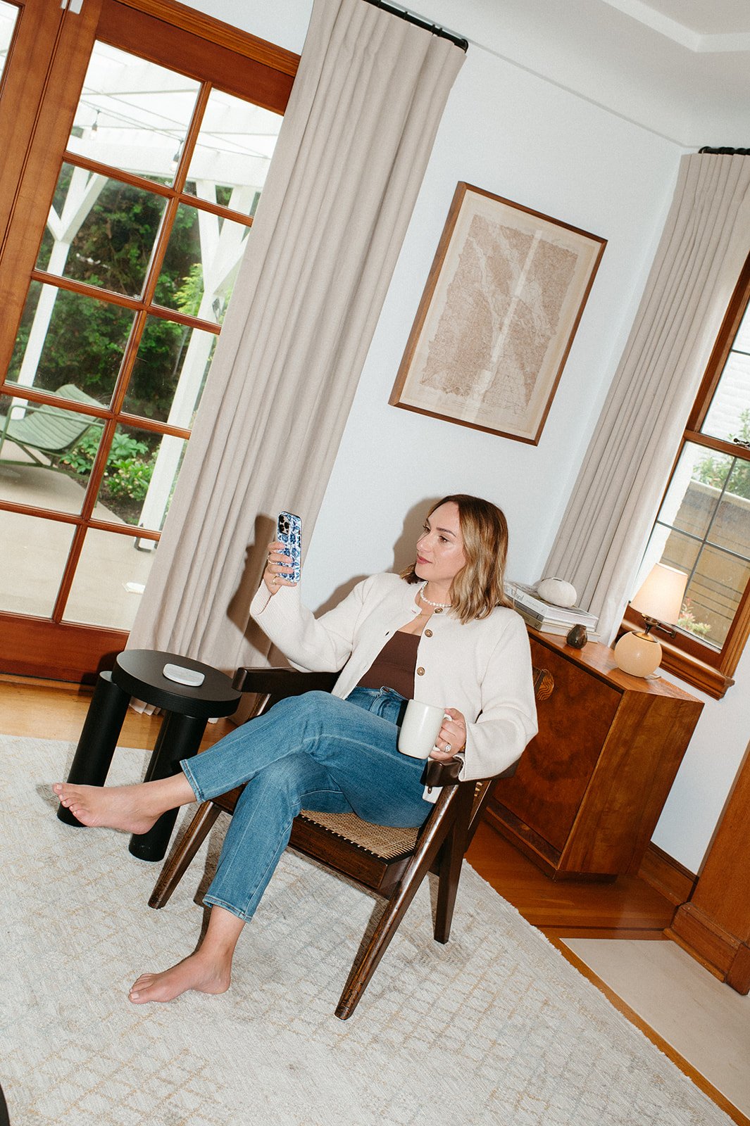 Portland OR realtor Alison Derse checking her phone for home updates