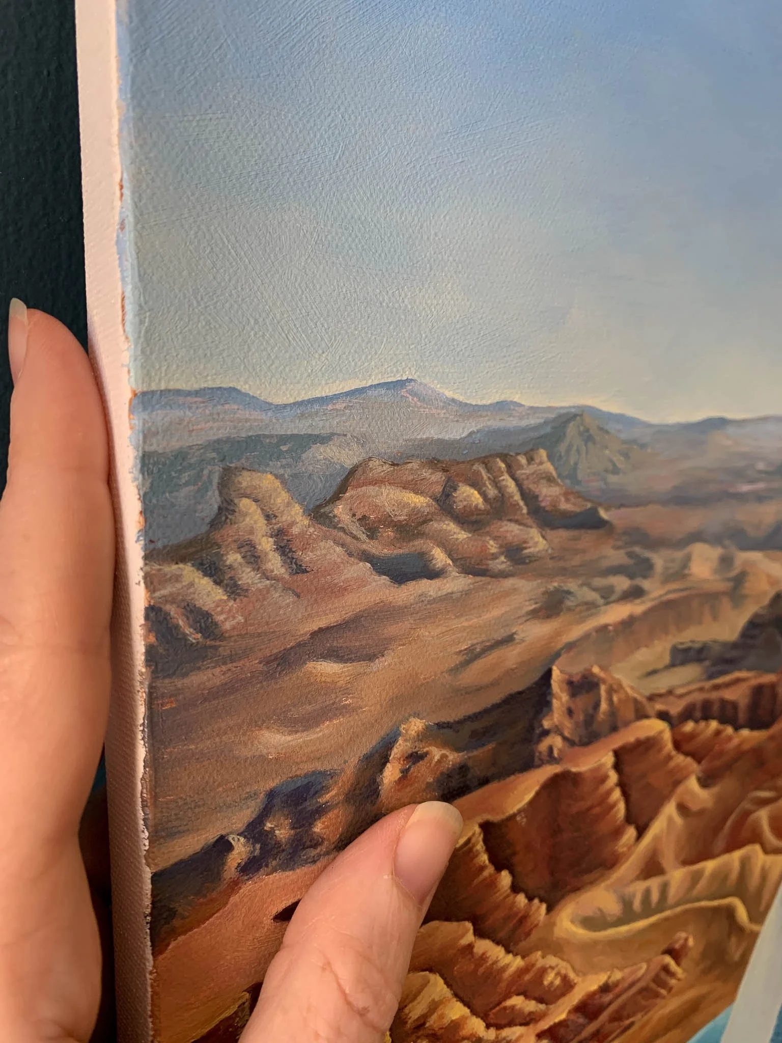 Room to Breathe is an oil painting on canvas of a woman in a blue hat overlooking Grand Canyon National Park. It was painted by Chelsea Heresco Parker. (Copy)