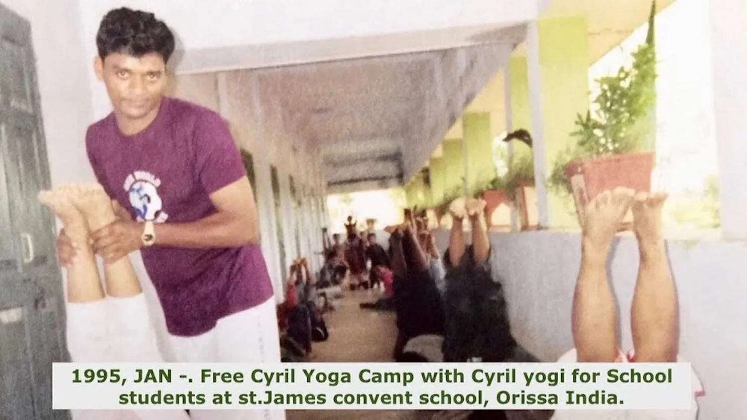 A young man in a maroon t-shirt and white pants demonstrating a yoga pose with students in the background at a school corridor. Potted plants are on display, and sunlight filters in from open windows. Caption mentions a free yoga camp for students at