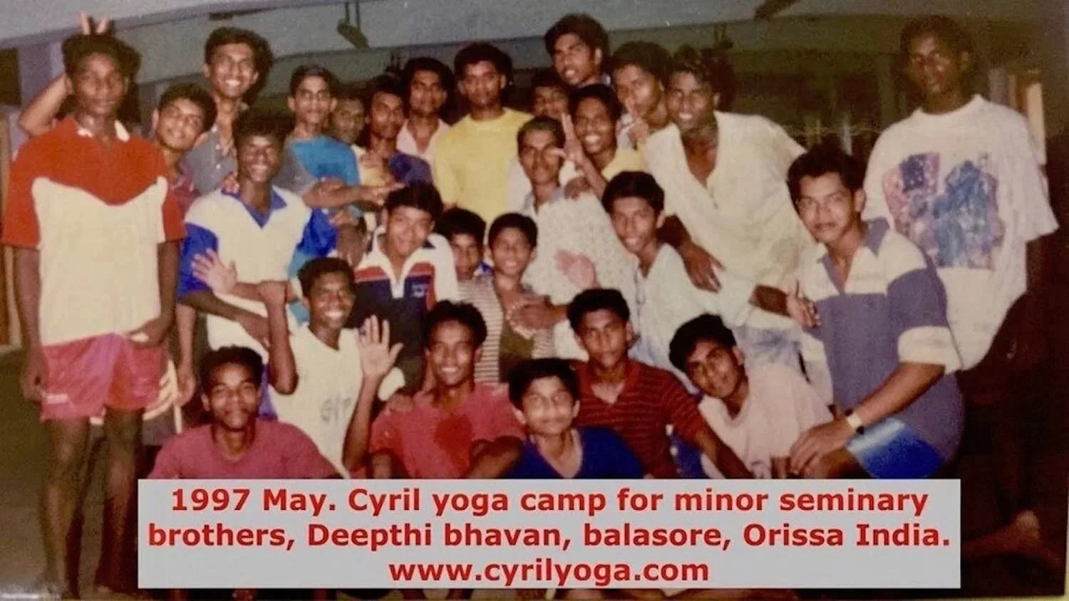Group of young men and boys at Cyril yoga camp in Deepthi Bhavan, Balasore, Orissa, India, May 1997, smiling and posing for a photo.