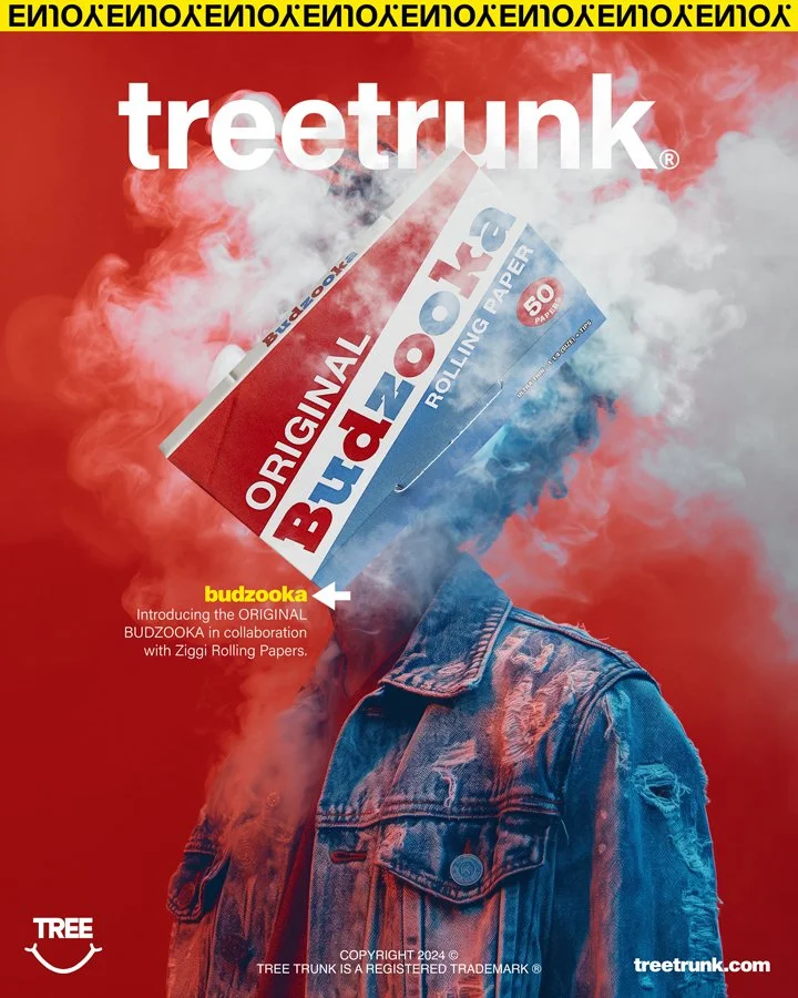 An advertisement featuring a person with a box of BUDZOOKA rolling paper covering their face, in front of a red background with smoke. Text mentions introducing the ORIGINAL BUDZOOKA in collaboration with Ziggi Rolling Papers.
