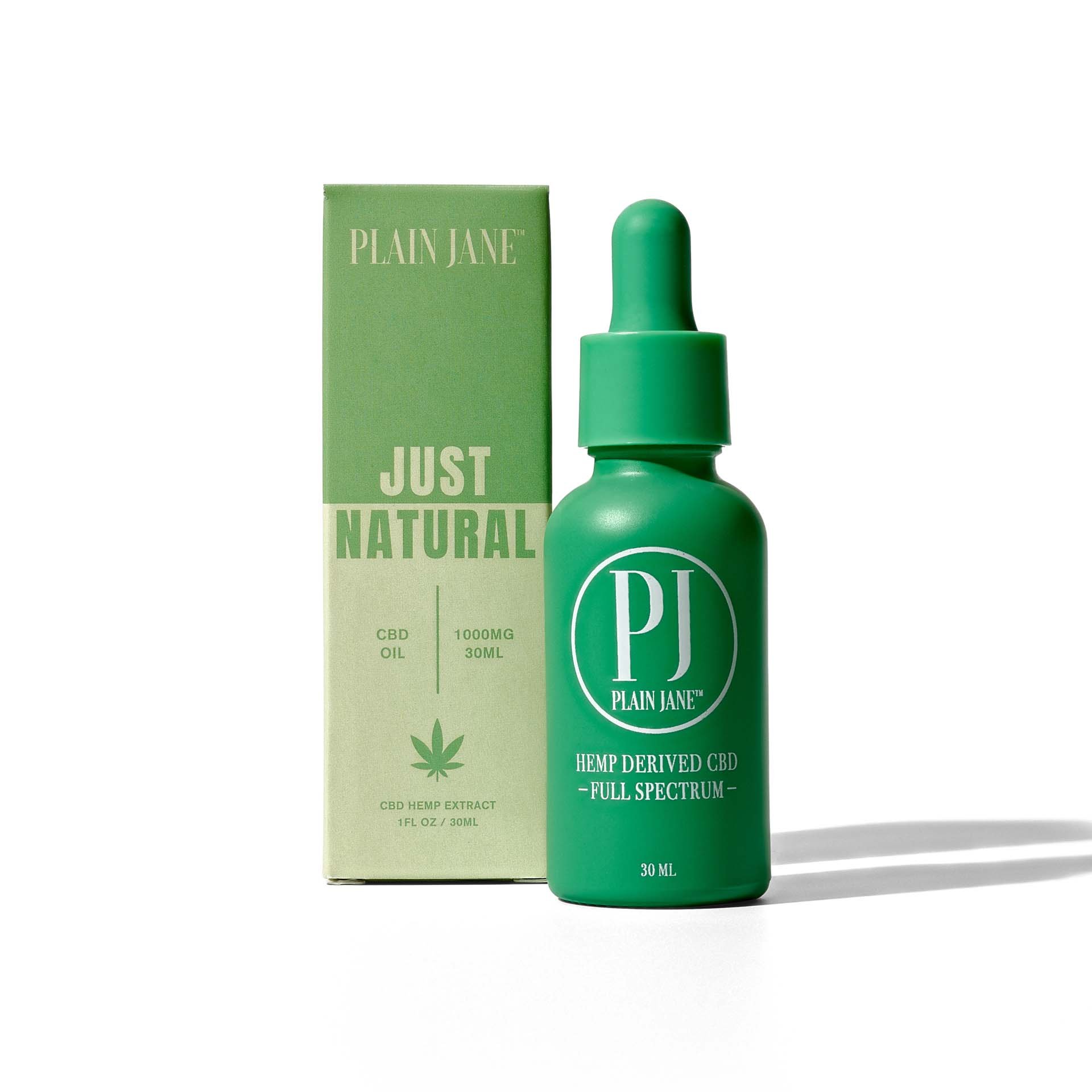 Plain Jane - Just Natural CBD oil, photograph with green tincture bottle.jpg