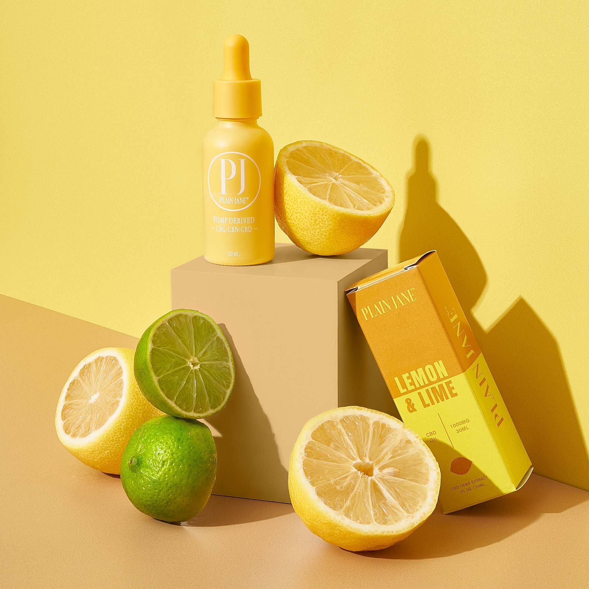 Plain Jane - Lemon & Lime CBD oil, photograph with yellow tincture bottle_.jpg