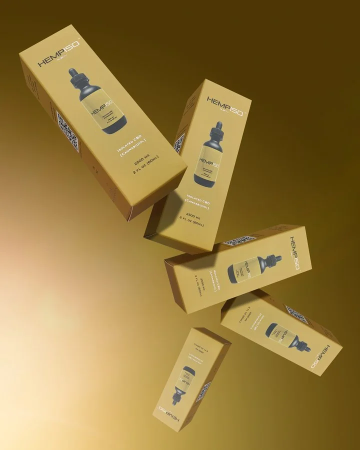 Multiple boxes of HEMP ISO CBD oil bottles floating against a golden background.