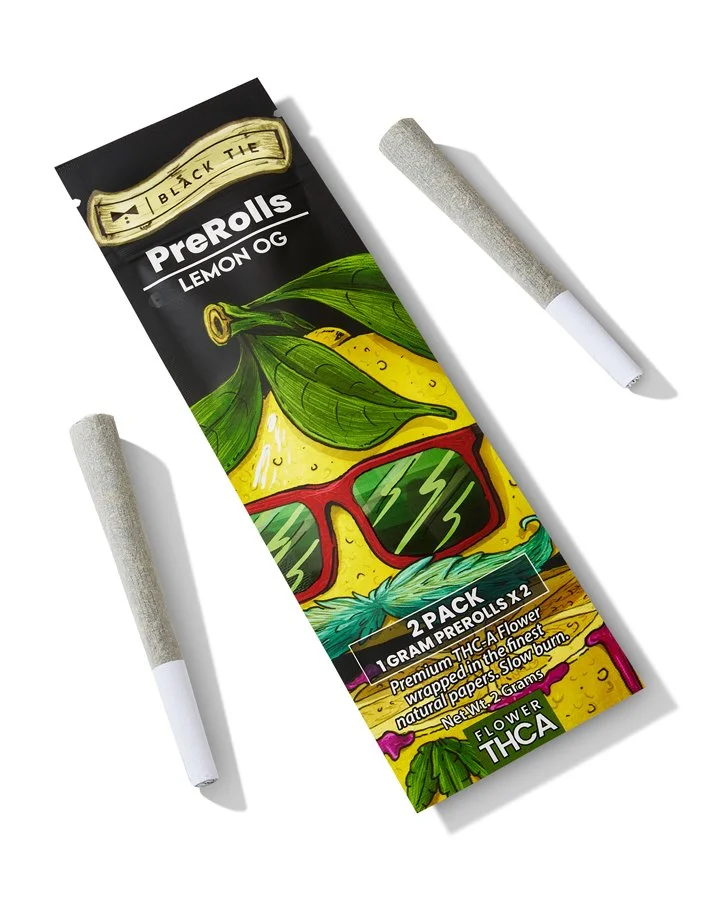 Two pre-rolled hemp cones with cannabis packaging featuring a tropical theme and sunglasses.
