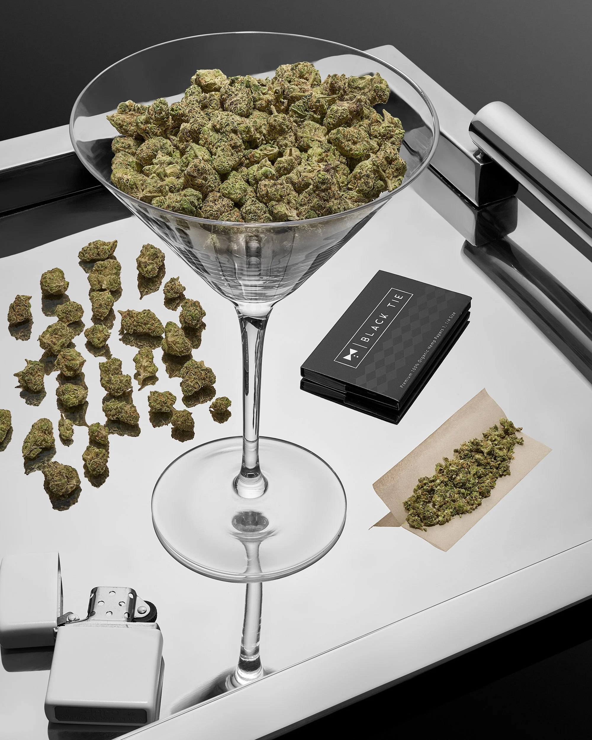 Black Tie – Gush Mintz, Martini glass on proper butler tray, MINIS inside glass, Additional MINIS below on tray, Separate section broken down roll-ready, Rolling papers placed near breakdown section_.jpg