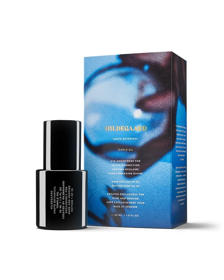 Bottle of Hildgaard Temple Oil for eye divine connection next to its packaging box, which features a blurred image of a hand holding an eye.
