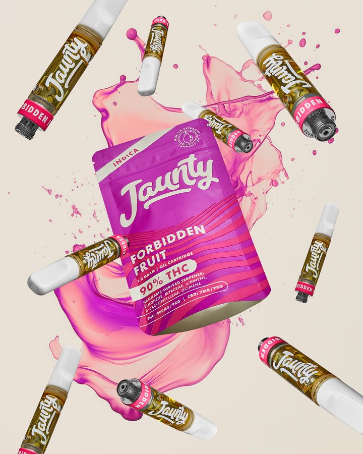 A purple bag labeled 'Tauny Forbidden Fruit' with THC content, surrounded by vape cartridges and splashes of pink liquid on a light background.