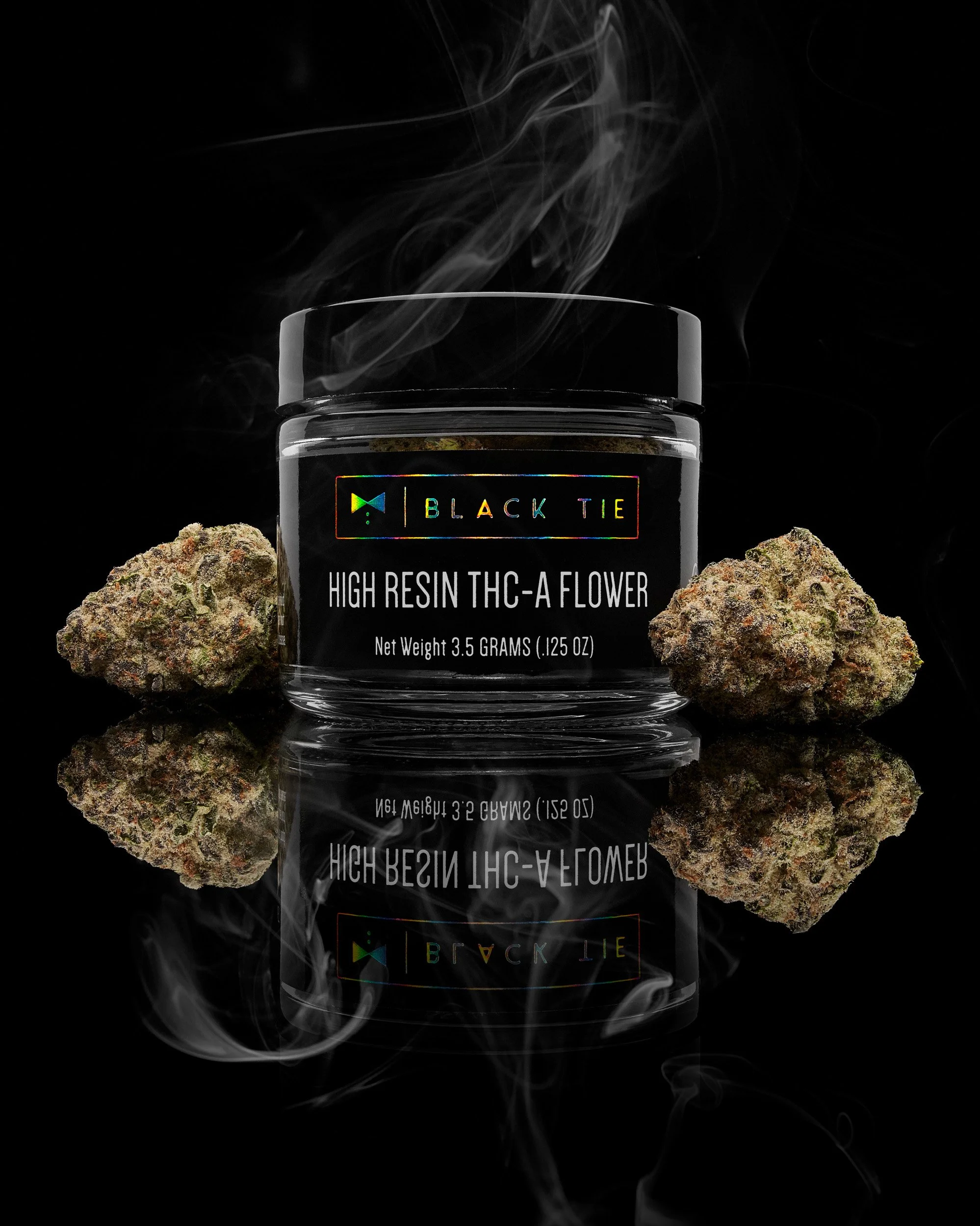 Black Tie - Bubblegum OG, flower and jar, with subtle smoke, on a black glossy background.jpg