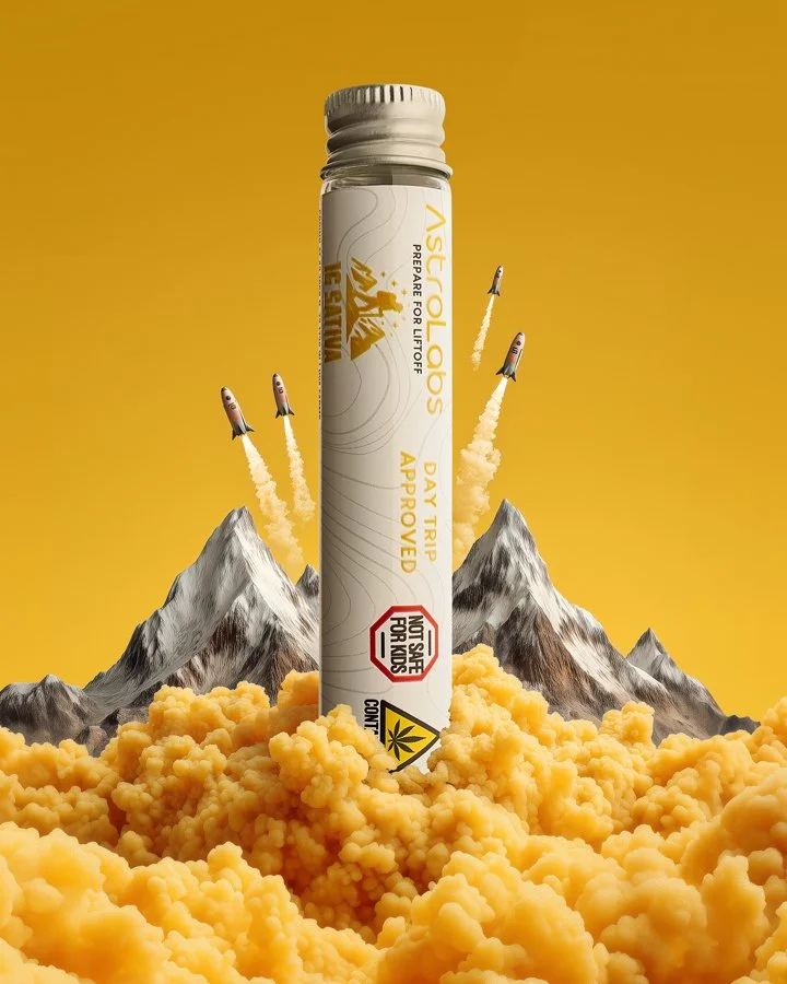 A container labeled 'AscoCOLABS' stands vertically among orange clouds, with three small rockets flying in the background, mountains all around, and a yellow backdrop.