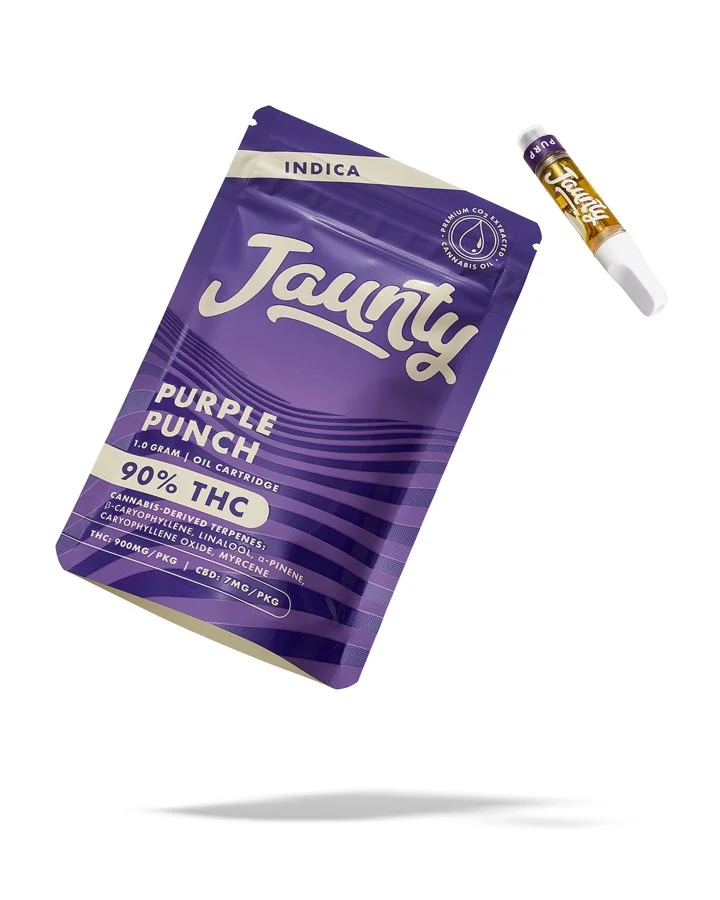 Package of Juanty Purple Punch cannabis oil with a syringe nearby, indicating it is for vaping or dabbing.