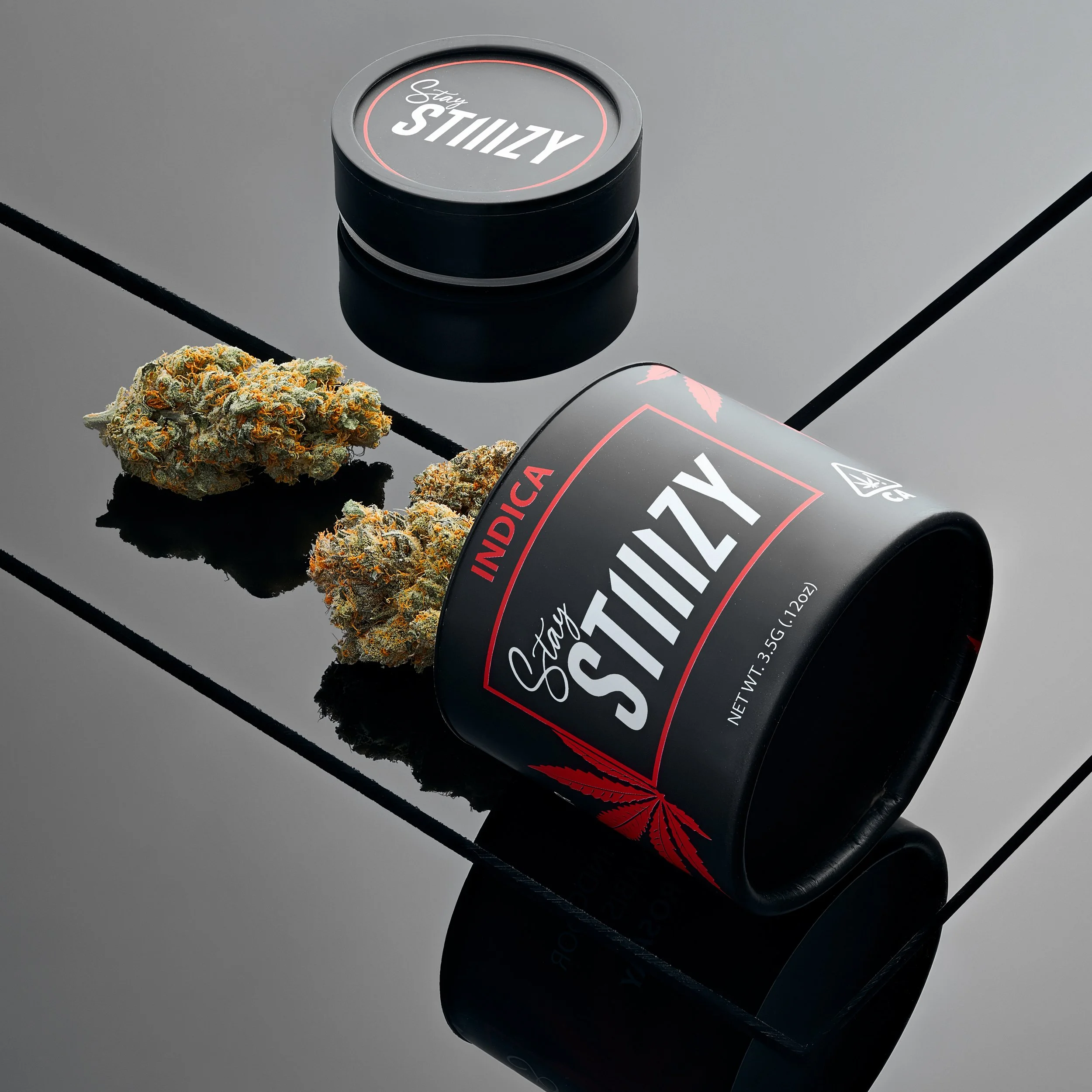 RXD Co - Stiiizy Indica, 3.5 gram (larger jar) ATID packaging, show one or two jars, on black plexi set_.jpg