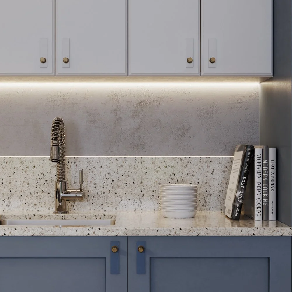 Kitchen planning and layout design for residential development with integrated cabinetry and feature lighting.