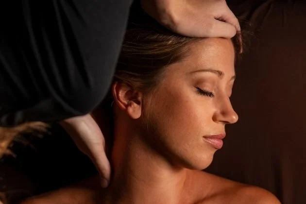 A woman improves her emotional wellness by getting a relaxing massage