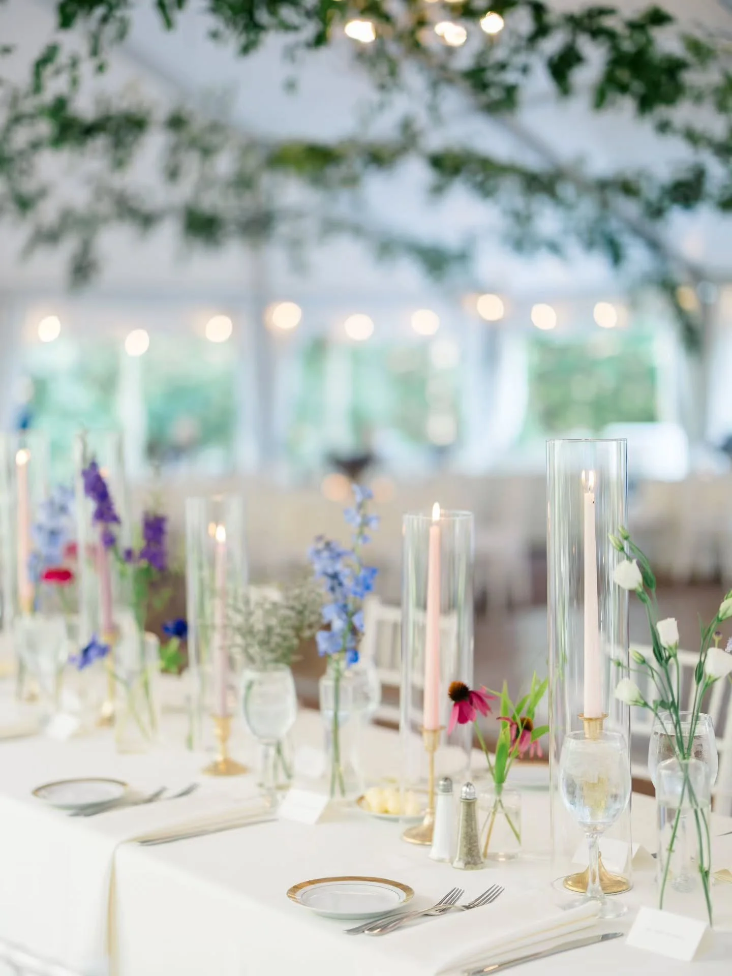 K &amp; J's head table - featuring our sleek highball bud vases, antique gold taper holders, and candles in soft pastel shades of pink &amp; purple. A perfect blend of simplicity and modern elegance.

Peek the last slide for the bride &amp; grooms re