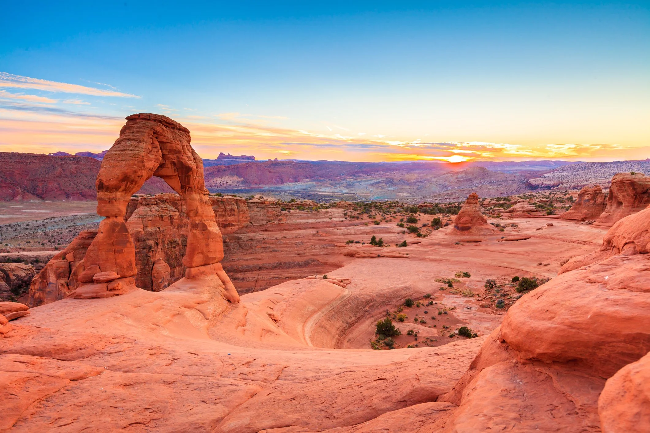 Desert sunrise arch landscape representing healing, identity exploration, and adoption competent therapy for adults