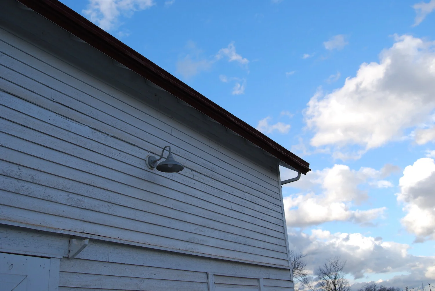 Exterior wall with clouds and light.JPG