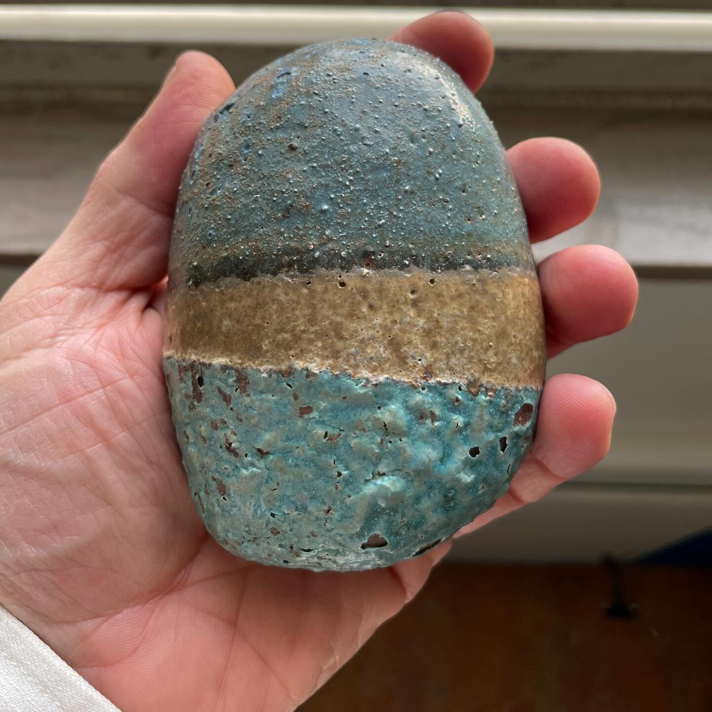 Cleveland art hive mind: this is a hollow ceramic &ldquo;pebble&rdquo;, rather lightweight, with something rattling inside like a small bead by the sound of it. I suspect it&rsquo;s an art piece, and would love to learn by whom. Any bells ringing? #w