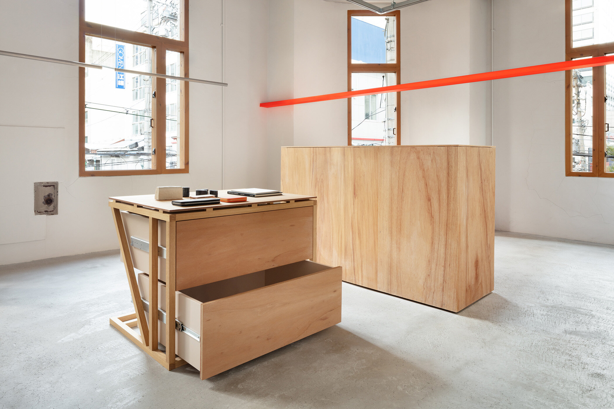  Yusuke Seki Studio designed a fashion stone I SEE ALL with lauan plywood made drawers. 
