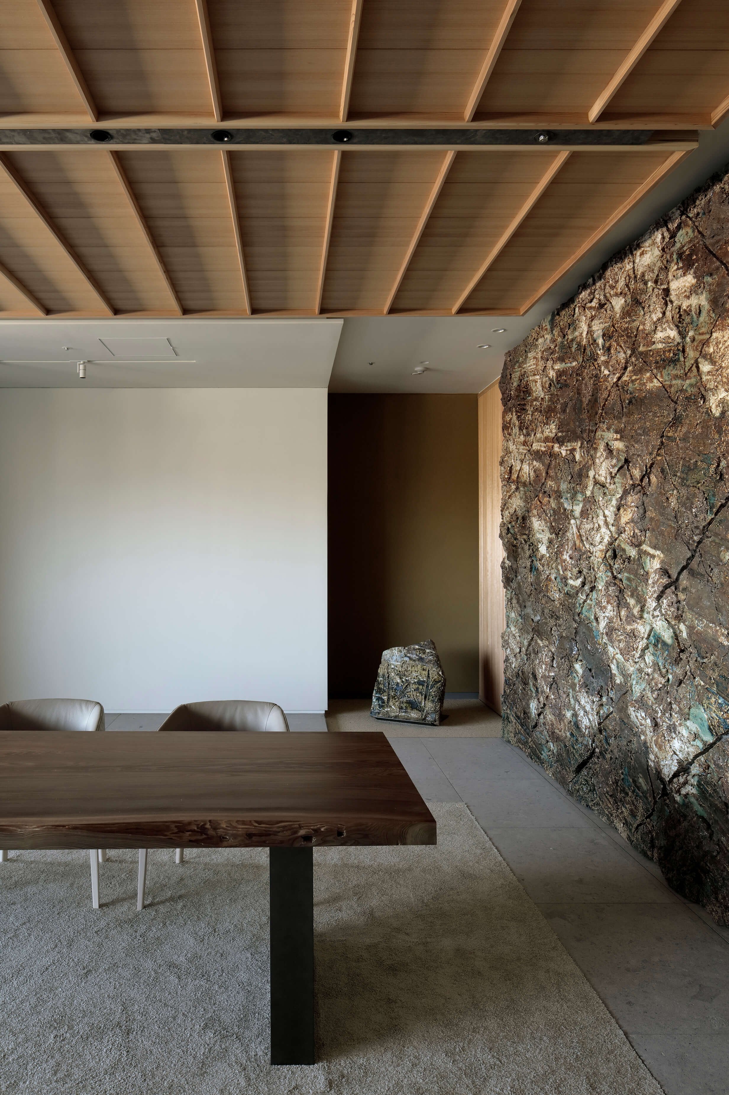 ceramic art wall and wooden table of ntv project by tomoyuki sakakida architect in tokyo japan