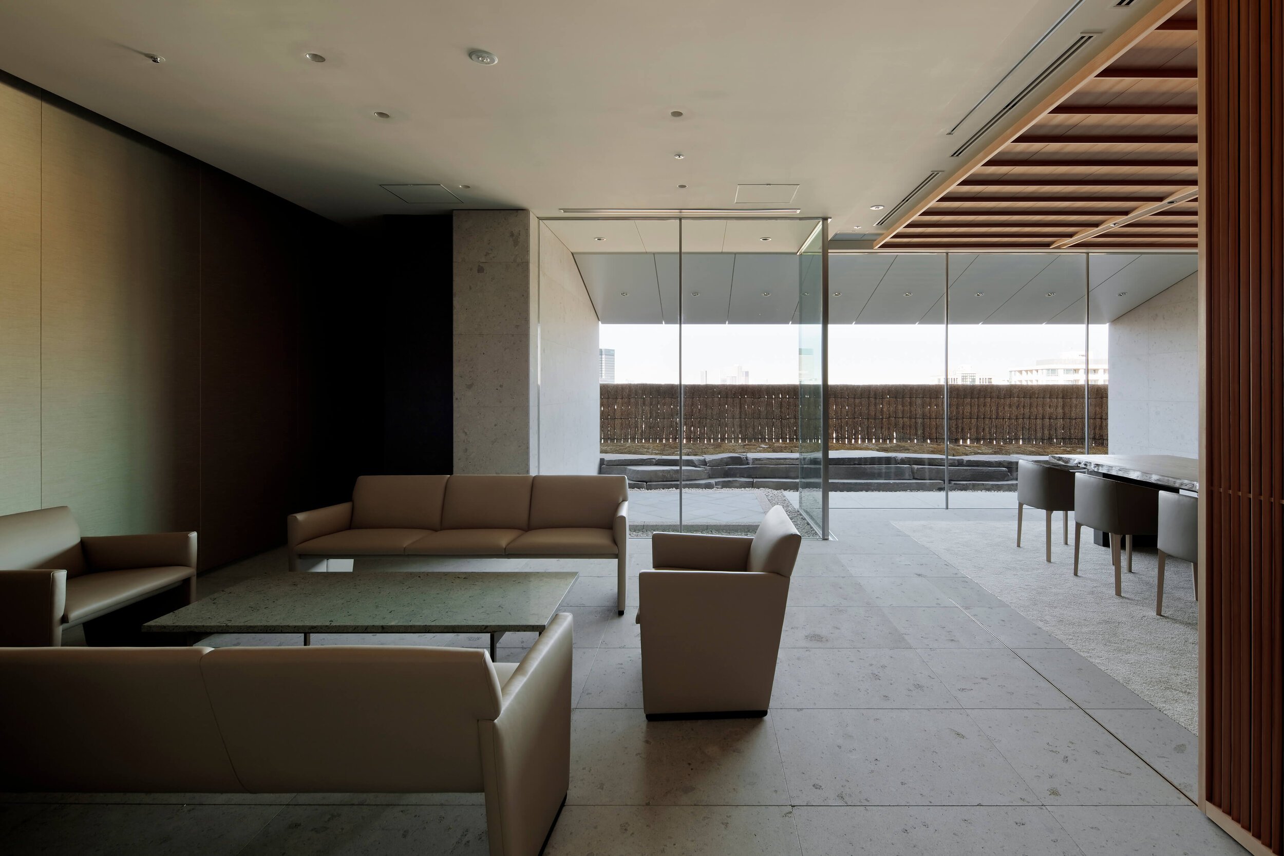 lounge with low sofas of ntv project by tomoyuki sakakida architect in tokyo japan