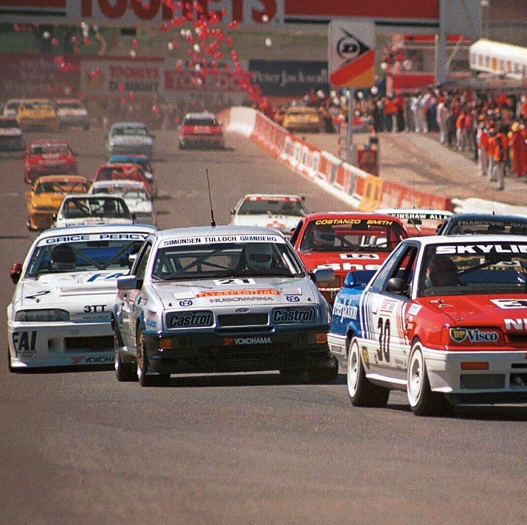 Green lights! This the start of the Tooheys Bathurst 1000, first round of the 1988 FIA Asia-Pacific Touring Car Championship. 

Ulf Granberg with the CMS Team Sweden Ford Sierra RS500 is packed between Alan Grice (Holden Commodore VL) and  George Fur